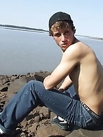 Handsome twink guy posing for the camera outdoors